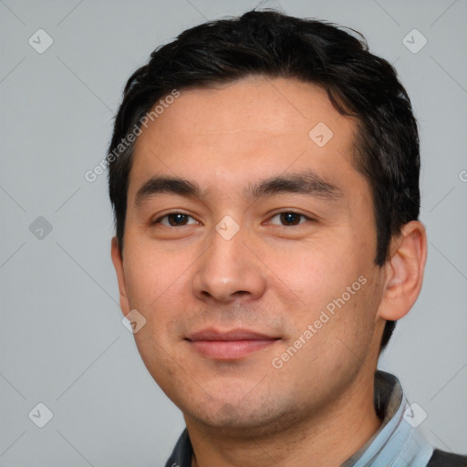 Joyful white young-adult male with short  black hair and brown eyes