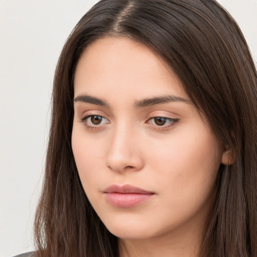 Neutral white young-adult female with long  brown hair and brown eyes