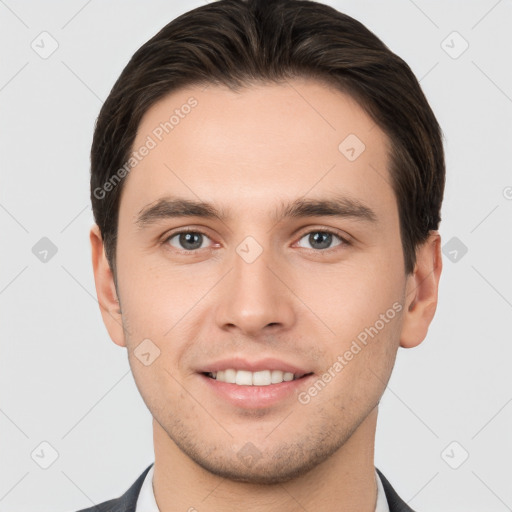 Joyful white young-adult male with short  brown hair and brown eyes