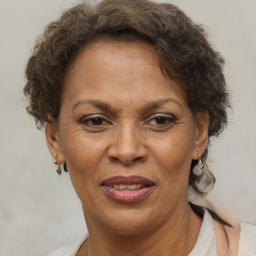 Joyful black adult female with short  brown hair and brown eyes