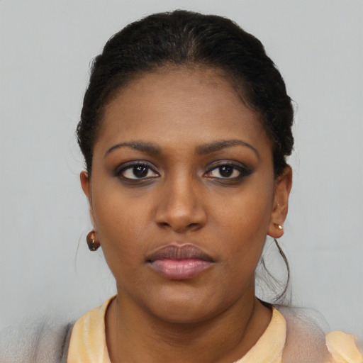 Neutral black young-adult female with short  black hair and brown eyes