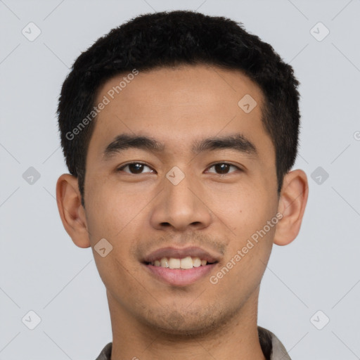 Joyful asian young-adult male with short  black hair and brown eyes