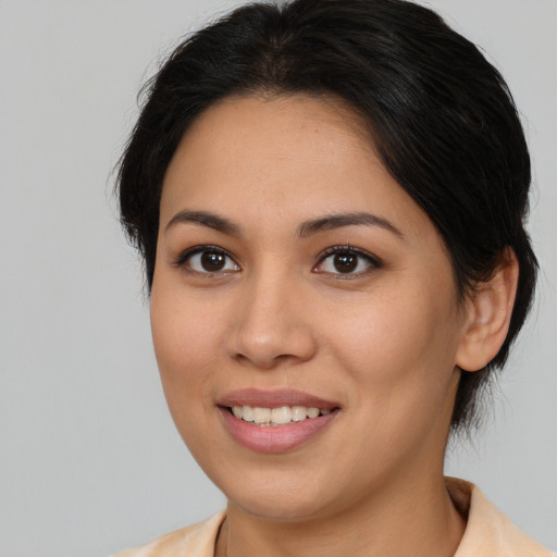 Joyful asian young-adult female with medium  brown hair and brown eyes