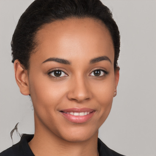 Joyful latino young-adult female with short  brown hair and brown eyes