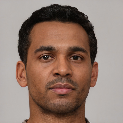 Neutral black young-adult male with short  black hair and brown eyes