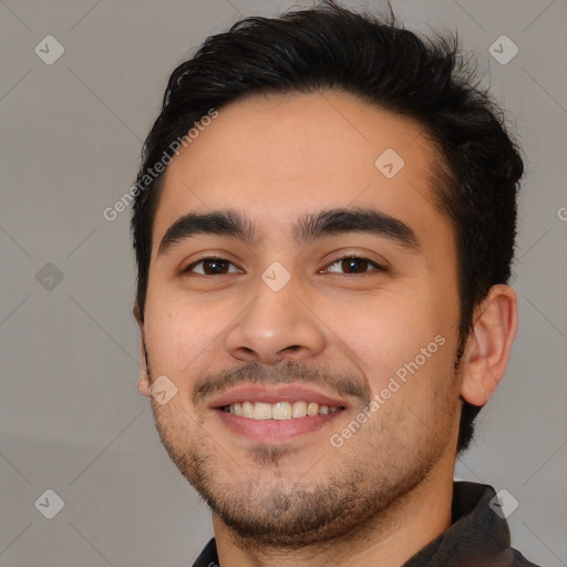 Joyful white young-adult male with short  black hair and brown eyes