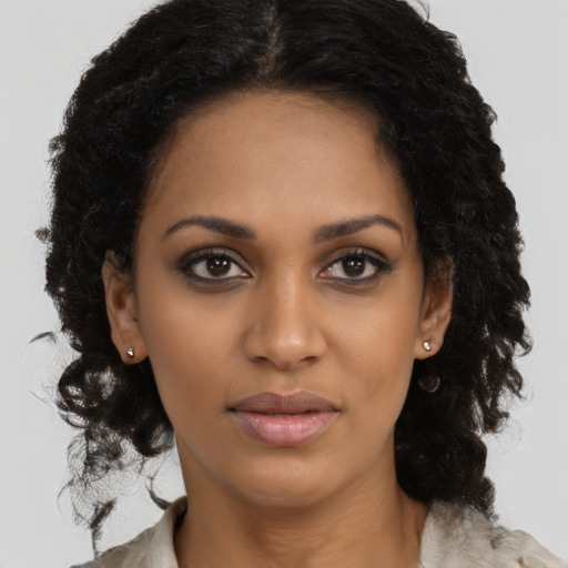 Neutral black young-adult female with long  brown hair and brown eyes