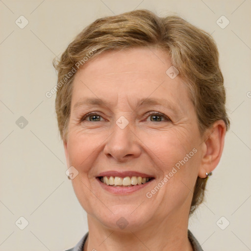 Joyful white adult female with short  brown hair and brown eyes