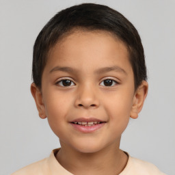 Joyful white child female with short  brown hair and brown eyes