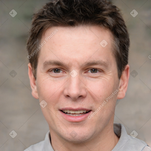 Joyful white adult male with short  brown hair and brown eyes