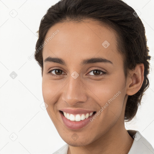 Joyful white young-adult female with short  brown hair and brown eyes