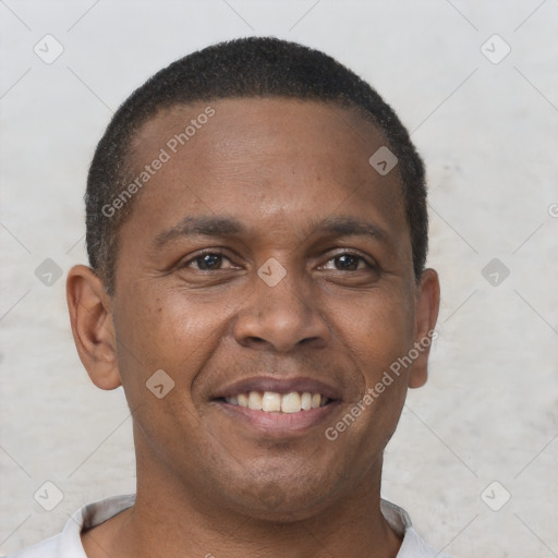 Joyful black young-adult male with short  brown hair and brown eyes
