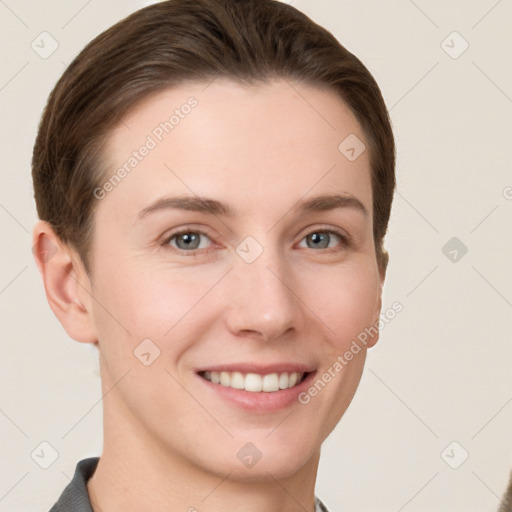 Joyful white young-adult female with short  brown hair and grey eyes