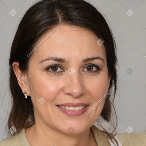 Joyful white adult female with medium  brown hair and brown eyes