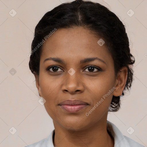 Joyful black young-adult female with short  brown hair and brown eyes