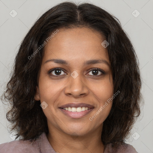 Joyful black young-adult female with medium  brown hair and brown eyes