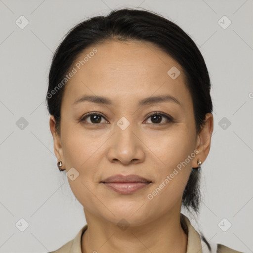 Joyful latino young-adult female with medium  black hair and brown eyes