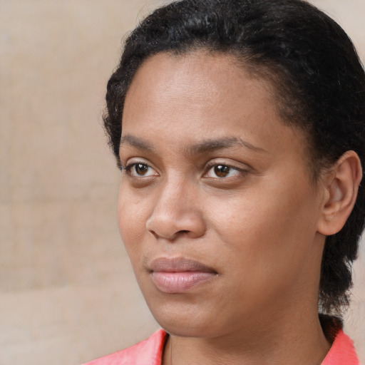 Joyful latino young-adult female with short  black hair and brown eyes