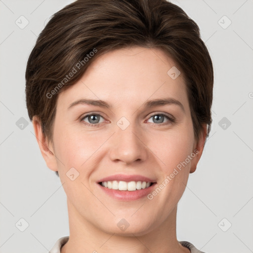 Joyful white young-adult female with short  brown hair and grey eyes