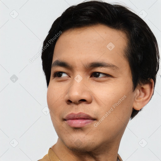 Joyful asian young-adult male with short  black hair and brown eyes