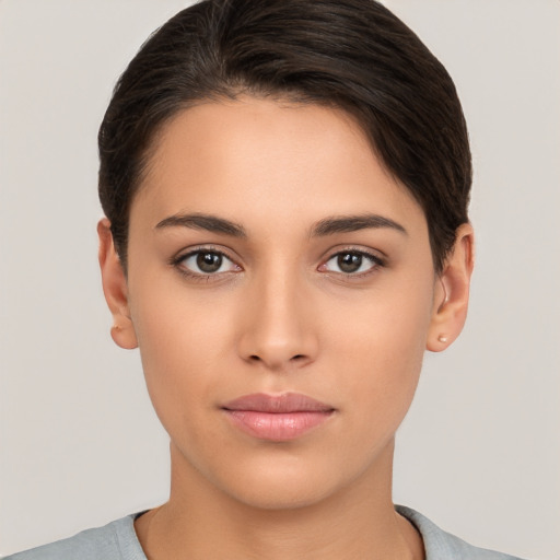 Neutral white young-adult female with short  brown hair and brown eyes