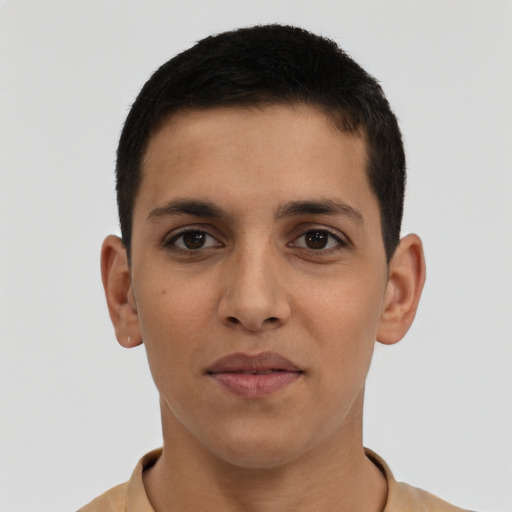 Joyful latino young-adult male with short  brown hair and brown eyes
