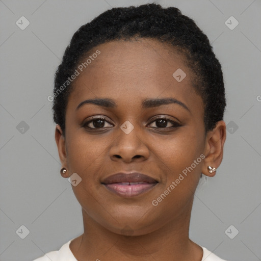 Joyful black young-adult female with short  black hair and brown eyes