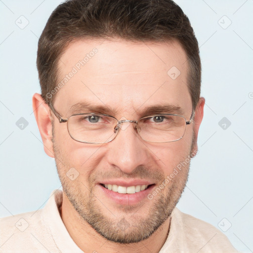 Joyful white adult male with short  brown hair and grey eyes