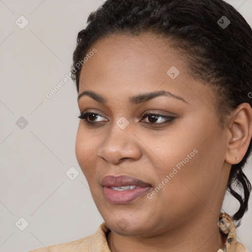 Joyful black young-adult female with short  brown hair and brown eyes