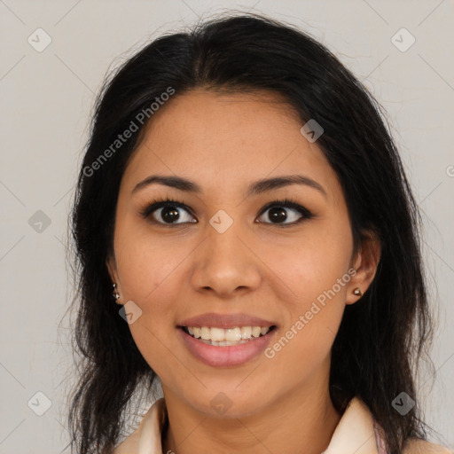 Joyful latino young-adult female with medium  brown hair and brown eyes