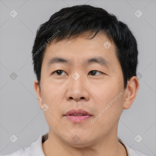 Neutral asian young-adult male with short  black hair and brown eyes
