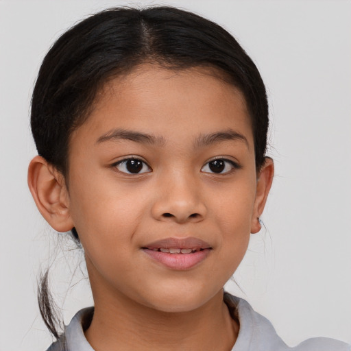 Joyful asian child female with medium  brown hair and brown eyes