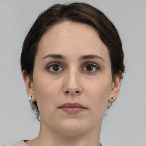 Neutral white young-adult female with medium  brown hair and brown eyes