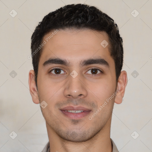 Joyful latino young-adult male with short  black hair and brown eyes