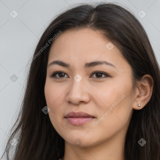 Joyful latino young-adult female with long  brown hair and brown eyes