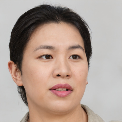 Neutral asian adult female with short  brown hair and brown eyes