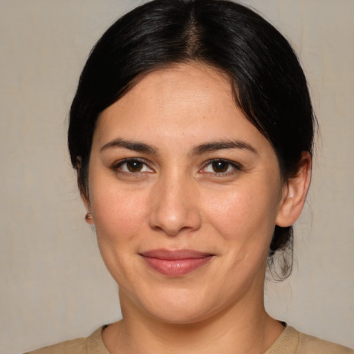 Joyful white young-adult female with medium  brown hair and brown eyes