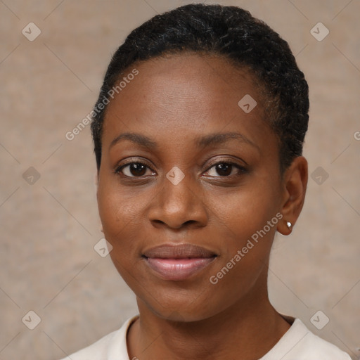 Joyful black young-adult female with short  brown hair and brown eyes