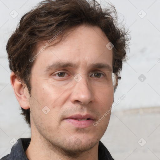 Joyful white adult male with short  brown hair and grey eyes