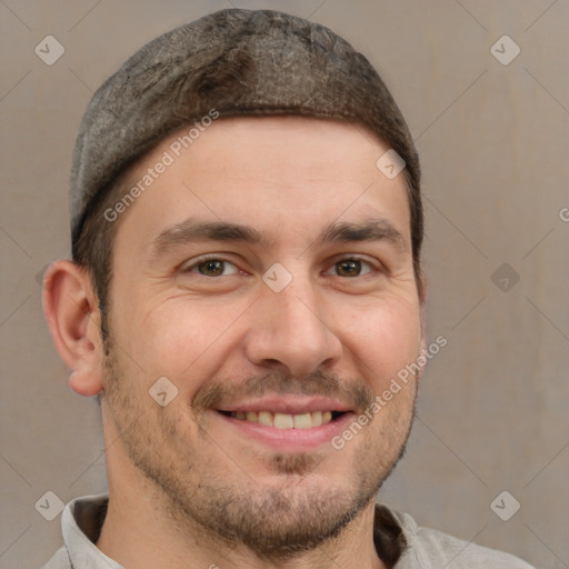 Joyful white adult male with short  brown hair and brown eyes