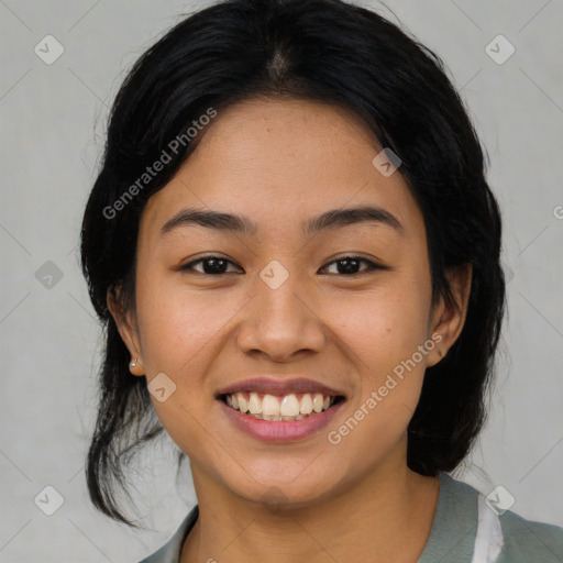 Joyful asian young-adult female with medium  black hair and brown eyes