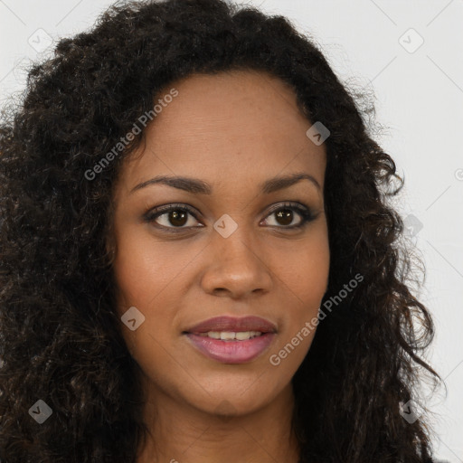 Joyful black young-adult female with long  brown hair and brown eyes