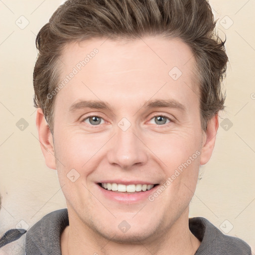 Joyful white adult male with short  brown hair and grey eyes