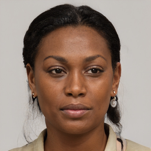 Neutral black young-adult female with medium  brown hair and brown eyes