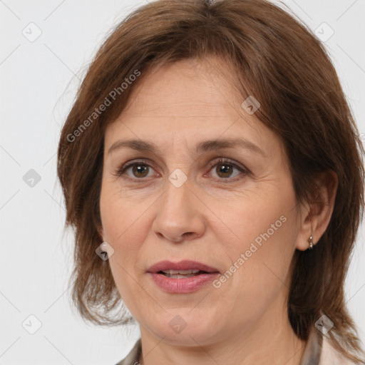 Joyful white adult female with medium  brown hair and brown eyes