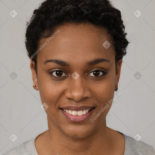 Joyful black young-adult female with short  black hair and brown eyes