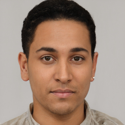 Neutral latino young-adult male with short  brown hair and brown eyes