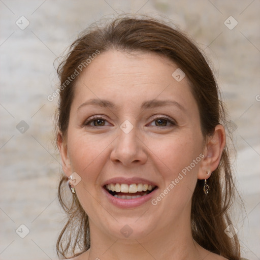 Joyful white young-adult female with medium  brown hair and grey eyes