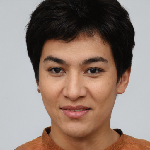 Joyful asian young-adult male with short  black hair and brown eyes