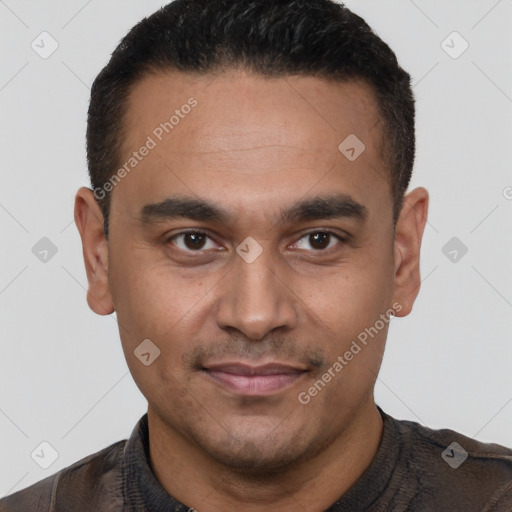 Joyful white young-adult male with short  black hair and brown eyes